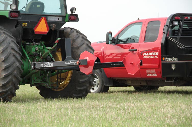 Bale loader technology for tractors and skid steers by DewEze